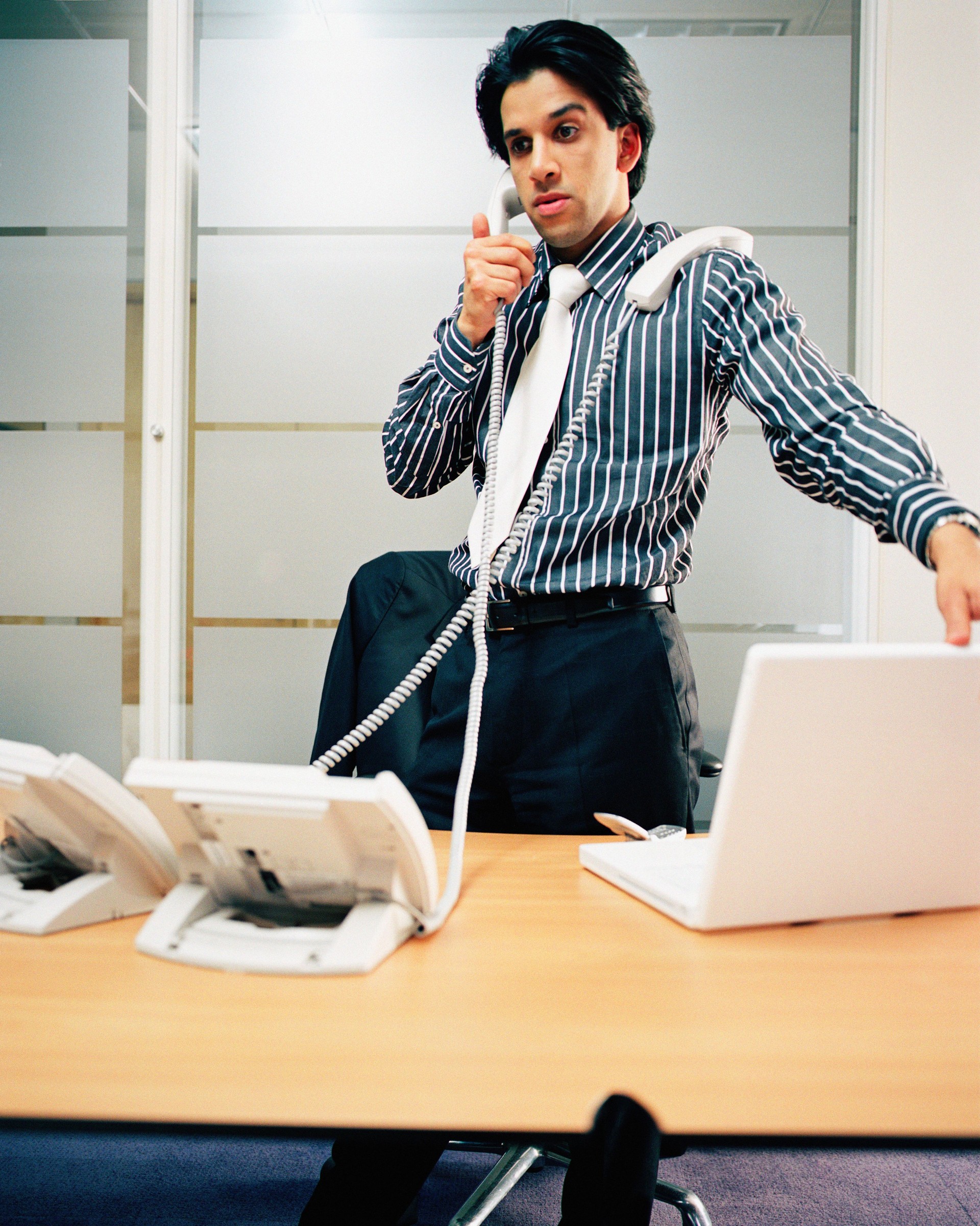 Businessman using telephone